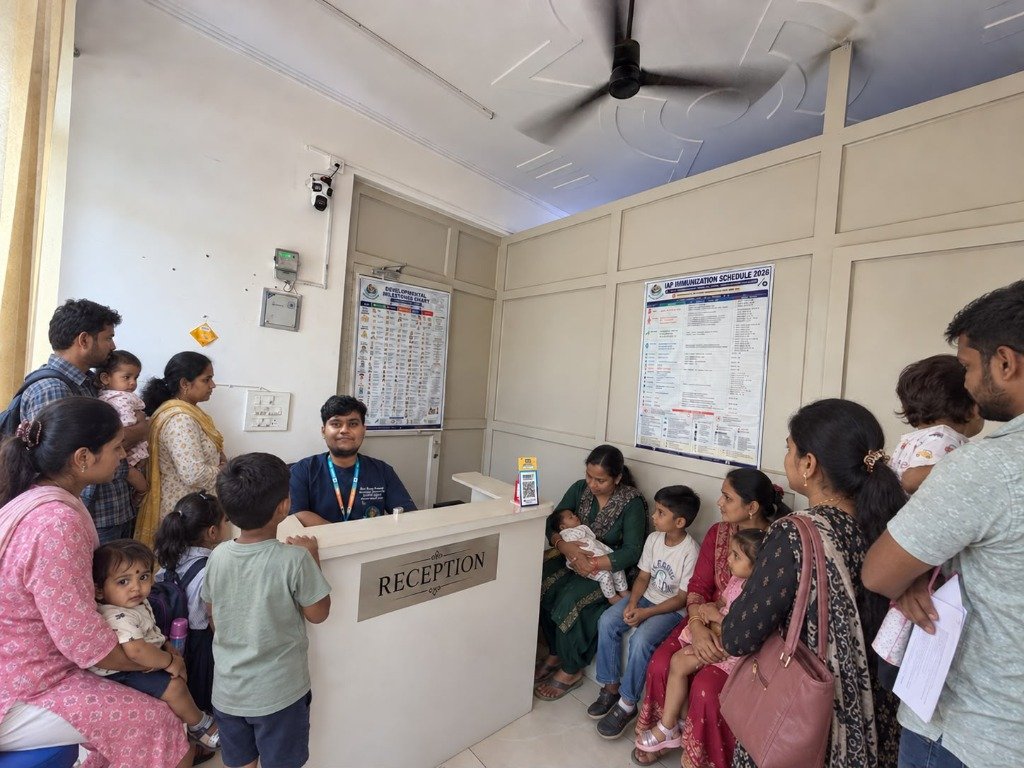 Dr. Debajyoti Banerjee Consulting Patients at Dhanvantari Clinic Reception